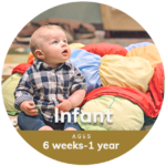 Infant sitting on mat at Little Sunshine's Playhouse and Preschool