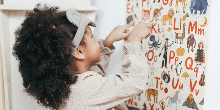 Little girl playing with letters